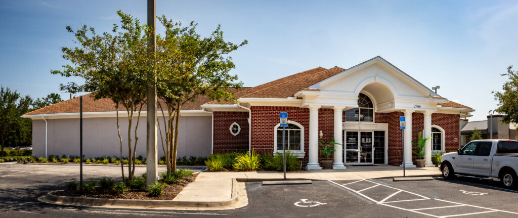 Brick building with white columns - Complete Family Eye Care