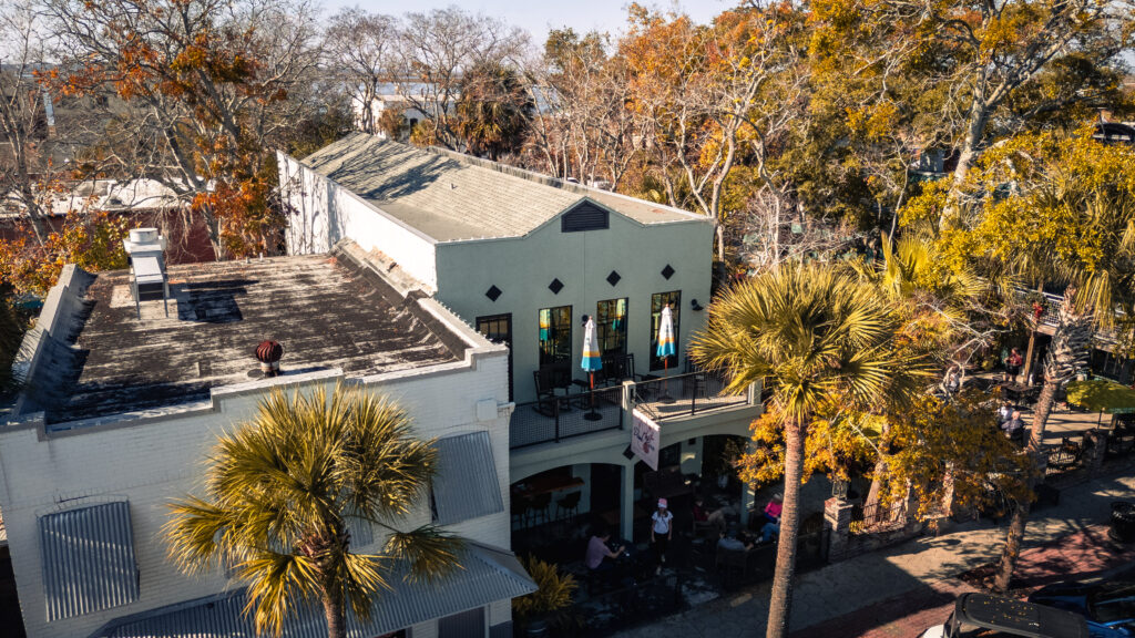 A white building surrounded by autumn leaves