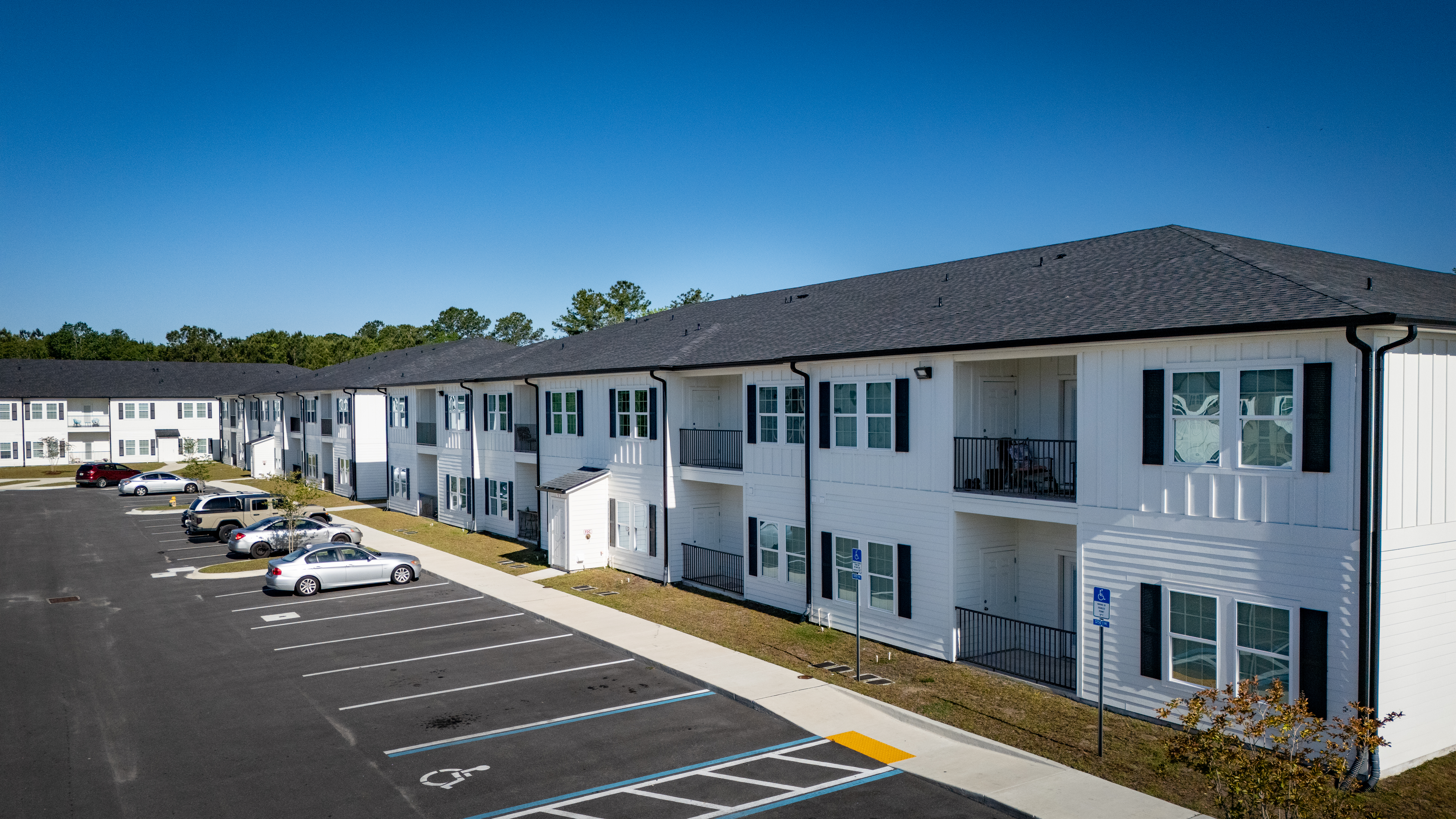 white two story apartment building
